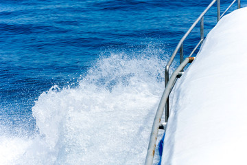 sea ocean water splash at beside. background day blue sky and cloud to transportation.