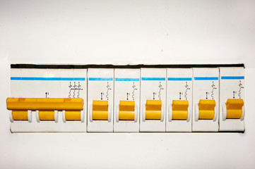 Group of automatic electrical switches on a white background.