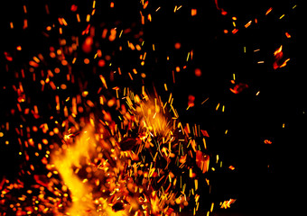flame of fire with sparks on a black background