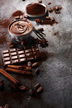 Chocolate bars on table with chocolate powder.