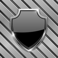 Black security shield sign. On metal background
