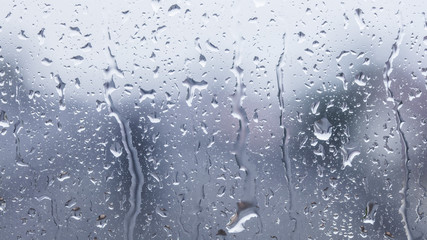 rainy days, rain drops on the window surface 