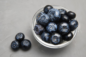Blueberries in Glass Bowl Isolated on Gray Textured Background Fresh Berry Copy Space