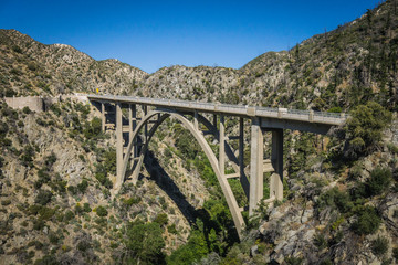 Tall cement bridge over a canyon in the San Gabriel Mountains of Angeles National Forest.