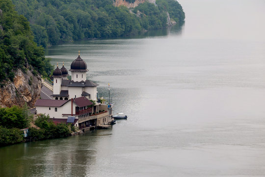 Summer landscape of Danube Gorge, at the border between Romania and Serbia. Mraconia orthodox monastery 