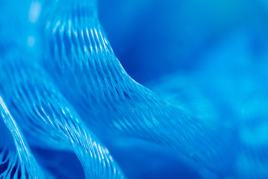 Blue synthetic sponge as an abstract background