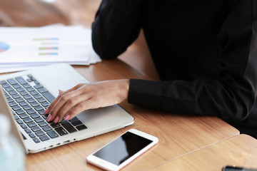 Businessmen are examining marketing results with a notebook