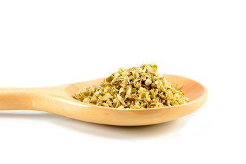 Oregano on the wooden spoon on a white background.