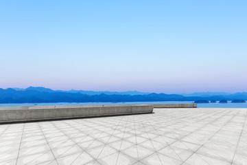 Empty square and lake in the city park