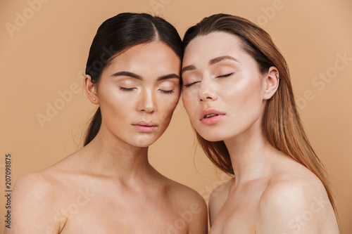 Beauty portrait closeup of two different nation women, asian ...