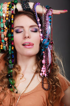 Pretty woman with jewelry necklaces bracelets