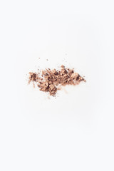 Powder foundations pieces on white background