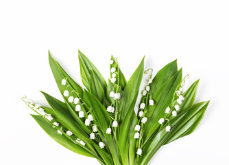 Beautiful bouquet of lilies of the valley isolated on white background. Top view. Flat lay.