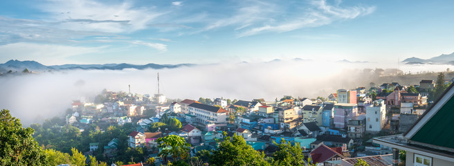 Landscape morning in small village in the valley on the plateau, distant fog shrouded the great hidden house on the outskirts of Dalat, Vietnam