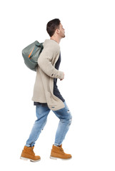 Naklejka premium Side view of a running man with a green bag.