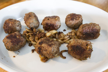 Making meatballs in a kitchen 