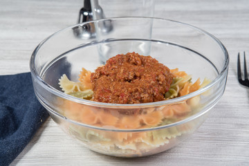 glass bowl of pasta Bolognese