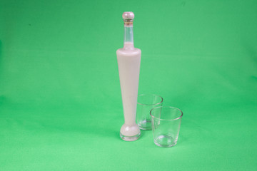 liquor bottle with two glasses