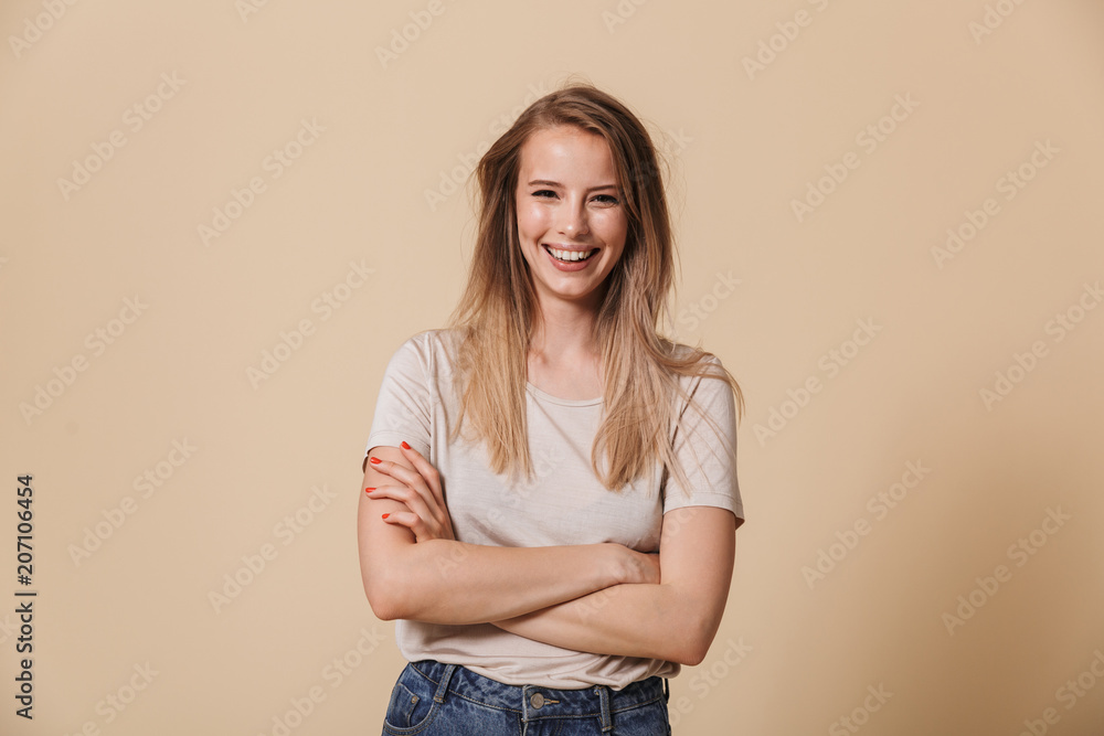 Sticker Portrait of a lovely casual girl with arms folded