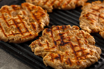 flat breads with cheese, onion and garlic on the grill
