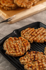 flat breads with cheese, onion and garlic on the grill