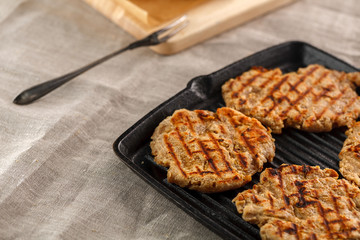 flat breads with cheese, onion and garlic on the grill