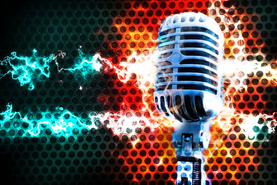 Microphone and stage lights.Concert and rock and heavy music concept. Live music background.Microphone and stage lights