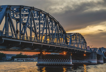 Krungthep - Rama III Bridge A bridge across the Chao Phraya River Between Ratchadapisek Road and Somdej Taksin Road in sunset ,Thon Buri in Bangkok Thailand.