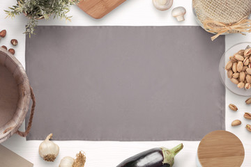 Kitchen table cloth surrounded with ingredients, spices and items for storing food. Old vintage style. Flat lay.