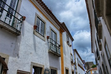 Narrow and colorful streets, facades and balconies of Obidos