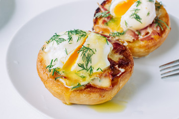Eggs benedict  on a plate close up