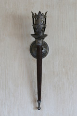 The lamp in the apartment, made as a mid-torch torch in the castle.