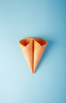Empty cone wafers on a blue background.