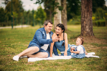 Fototapeta premium happy young family spending time outdoor on a summer day