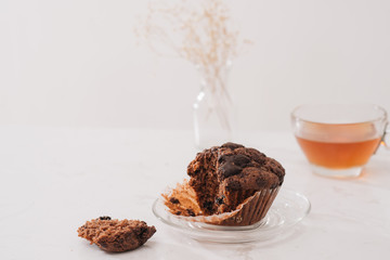 Breakfast with fresh homemade delicious muffins and tea.