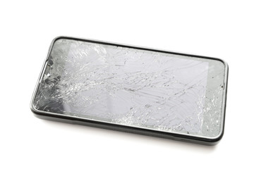 Broken smartphone screen on white background. Selective focus.