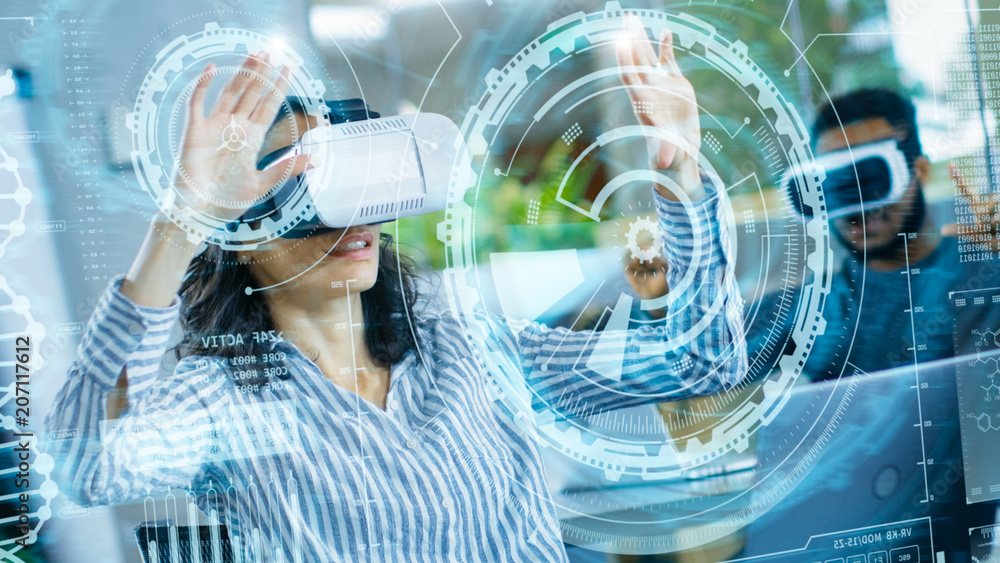 Poster female virtual reality engineer/ developer wearing virtual reality headset creates content with her 