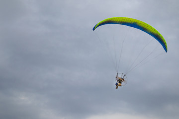 Para-motor flying on the sky.