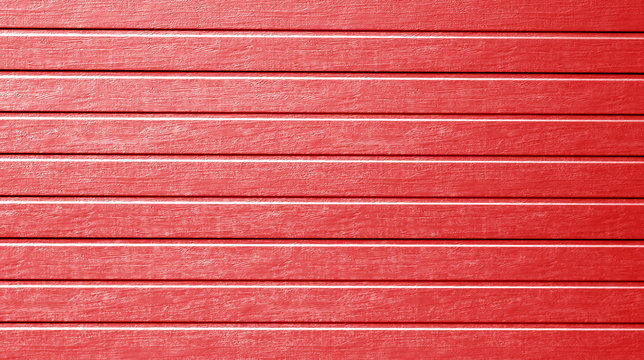Plastic siding wall texture in red color.