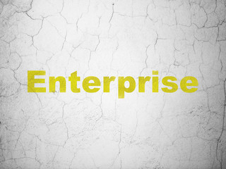 Finance concept: Yellow Enterprise on textured concrete wall background