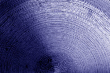 Metal surface with scratches in blue tone.