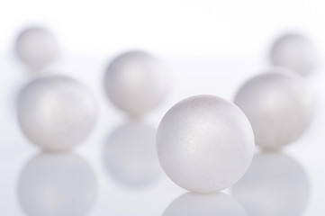 scattered pearl pearls on a white background