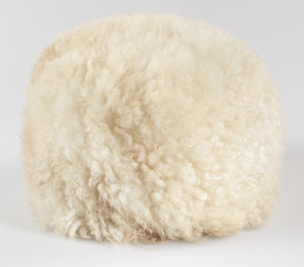 White caucasian papakha, of sheepskin, on white background