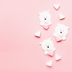 Delicate marshmallow dessert in the form of bears on a pink background. Flat layout. Copy space.