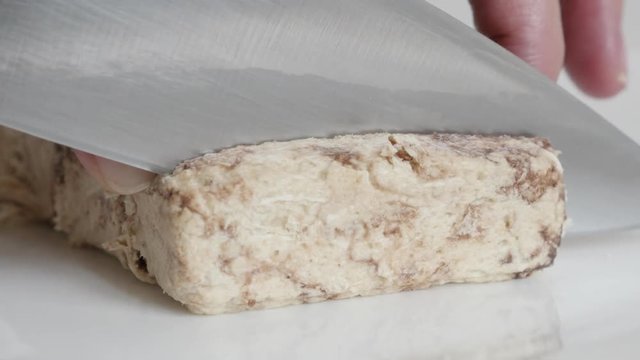 Tasty halva cutting close-up  video