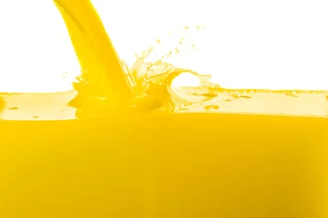Rolgordijnen orange juice splashing against white background © Colored emotions