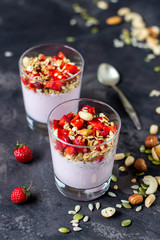 Granola with yogurt, strawberry and nuts, healthy breakfast