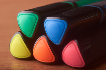 colored markers on the school table
