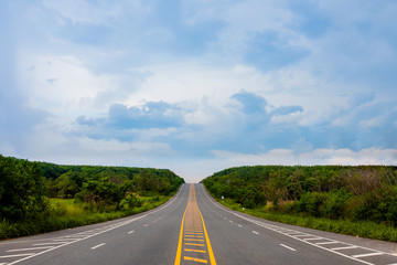 Hilly highway in countryside with bluesky background