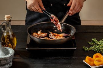 Chef cook the quail into the frying pan